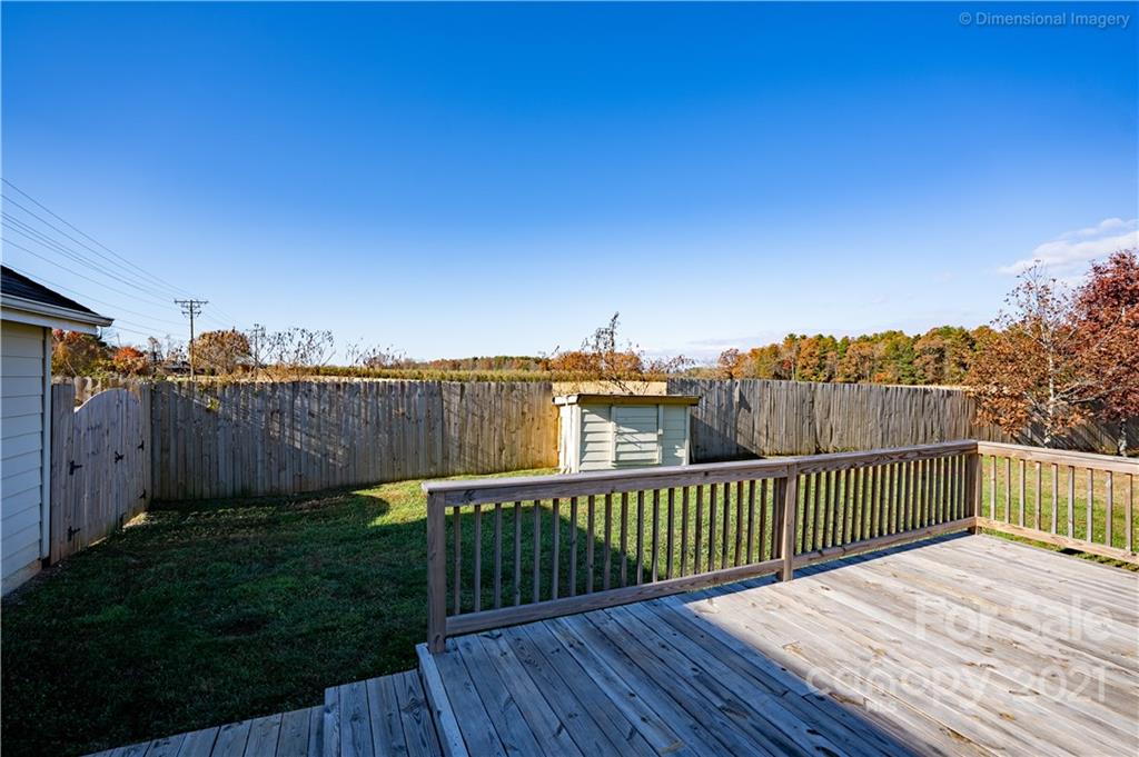 1117 North Ridge Road Hendersonville, NC 28792 - Photo 29 of 35 a view of a wooden deck with a yard