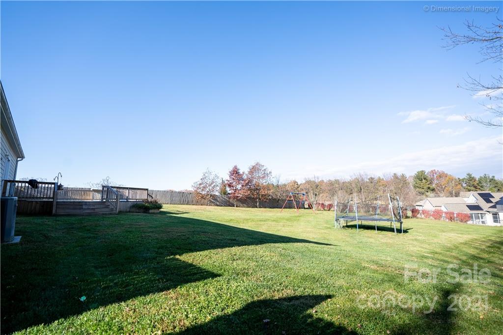 1117 North Ridge Road Hendersonville, NC 28792 - Photo 5 of 35 a garden with trees in the background