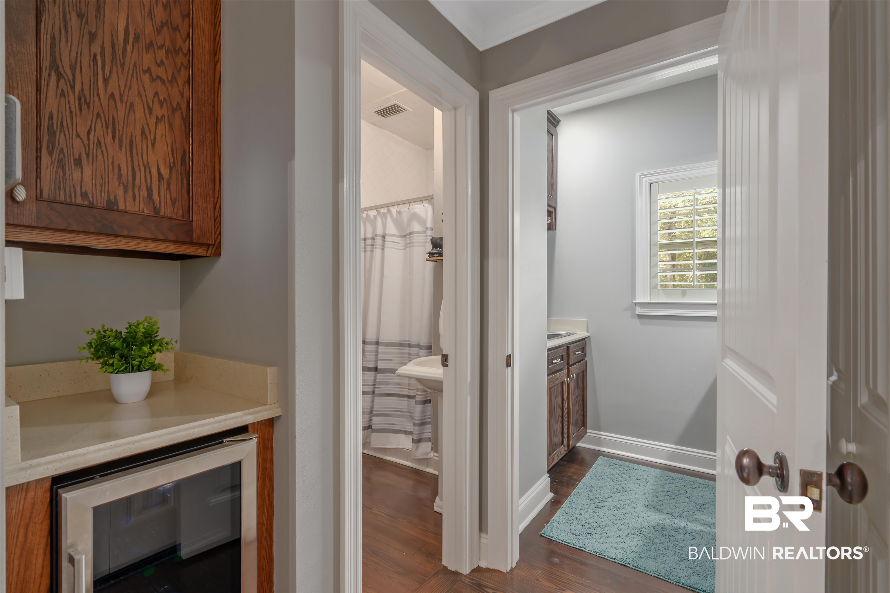 25591 Waterworld Road Robertsdale, AL 36567 - Photo 24 of 33 Interior space featuring wood-type flooring, vanity, and wine cooler