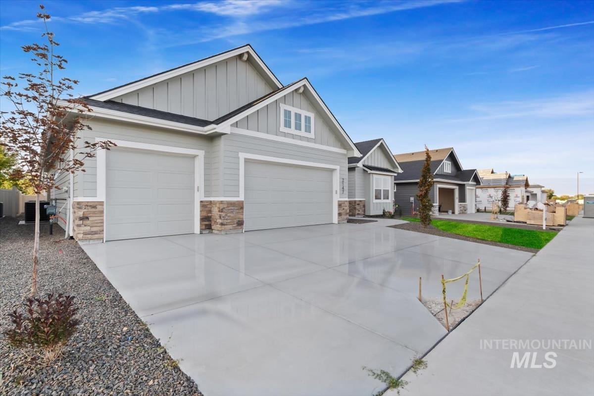 2147 East Blakehurst Avenue Kuna, ID 83634 - Photo 3 of 43 Craftsman inspired home with board and batten siding, driveway, and stone siding