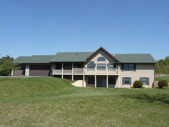 11311 Bailey Road Pecatonica, IL 61063 - Photo 1 of 11 a front view of a house with a yard