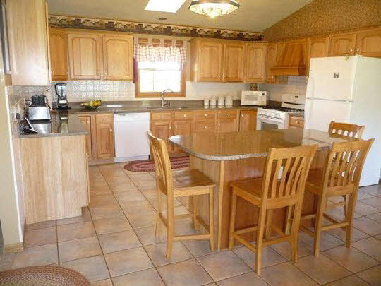 11311 Bailey Road Pecatonica, IL 61063 - Photo 3 of 11 a dining table chairs and a open kitchen view