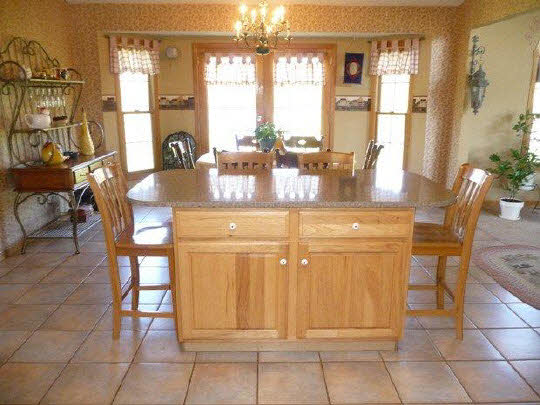 11311 Bailey Road Pecatonica, IL 61063 - Photo 4 of 11 a dining hall with stainless steel appliances a dining table and chairs
