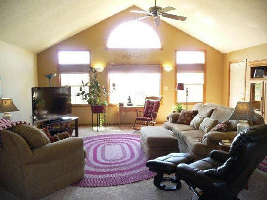 11311 Bailey Road Pecatonica, IL 61063 - Photo 5 of 11 a living room with furniture and a flat screen tv