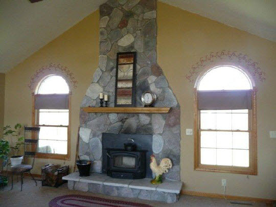 11311 Bailey Road Pecatonica, IL 61063 - Photo 6 of 11 a living room with furniture and a fireplace