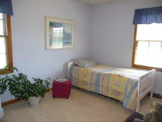 11311 Bailey Road Pecatonica, IL 61063 - Photo 10 of 11 a spacious bedroom with a bed and a window