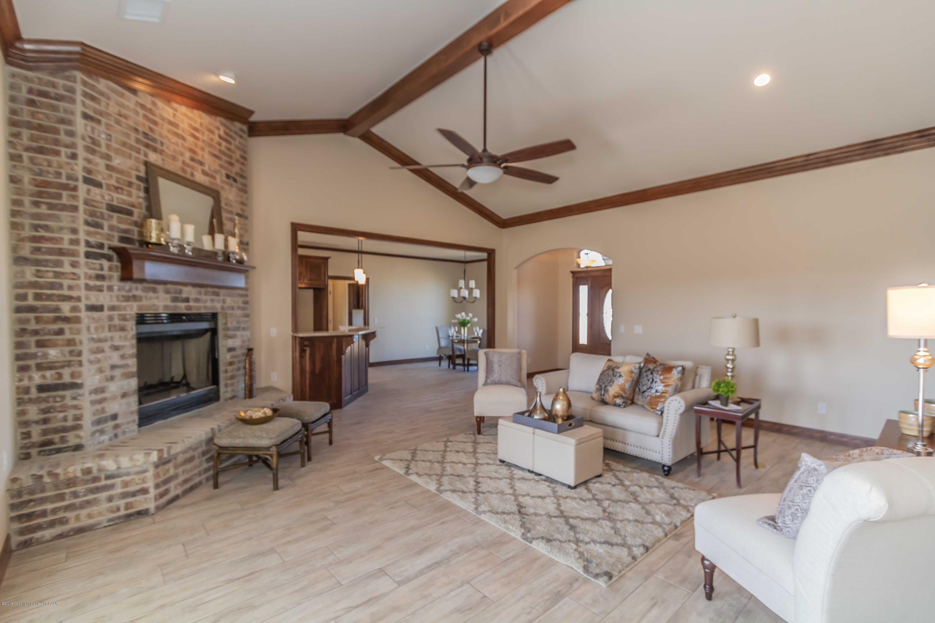 9801 Help Lane Amarillo, TX 79119 - Photo 8 of 46 a living room with fireplace furniture and a fireplace