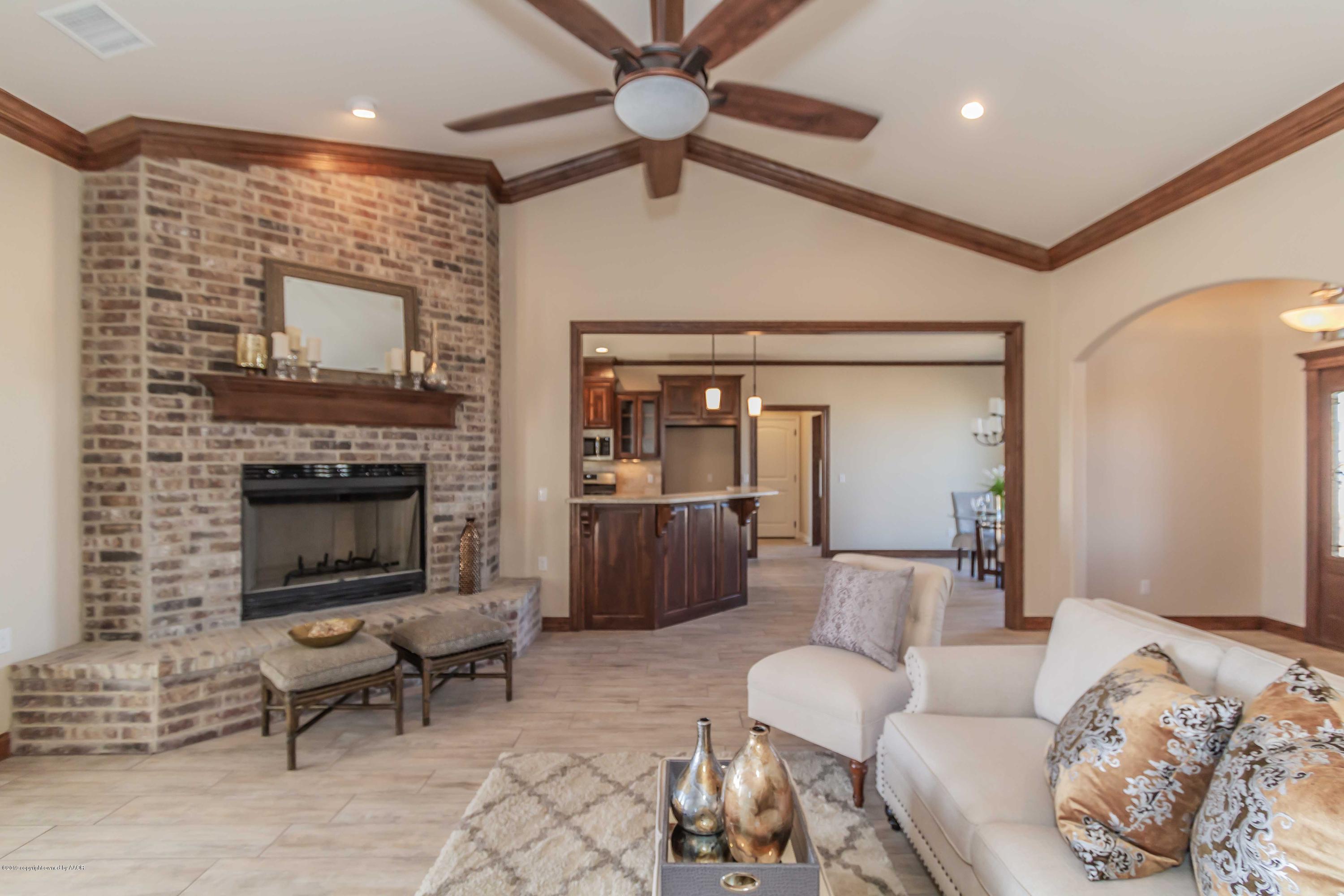 9801 Help Lane Amarillo, TX 79119 - Photo 9 of 46 a living room with furniture and a fireplace