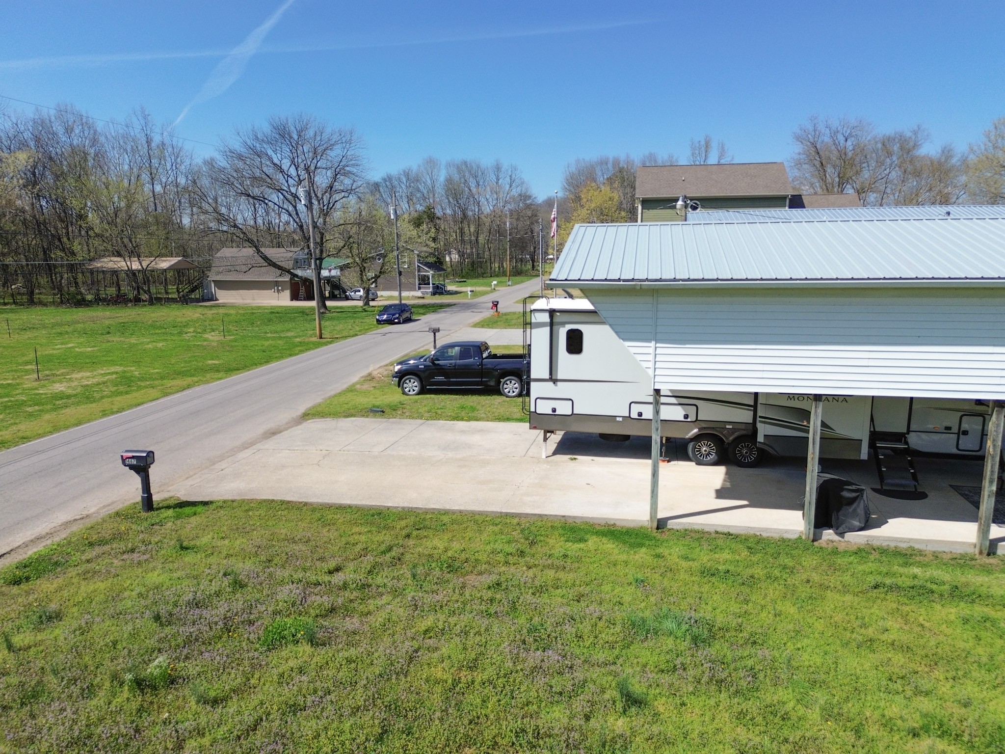 1467 Chapmansboro Road Chapmansboro, TN 37035 - Photo 7 of 13 a view of a house with a yard and sitting area