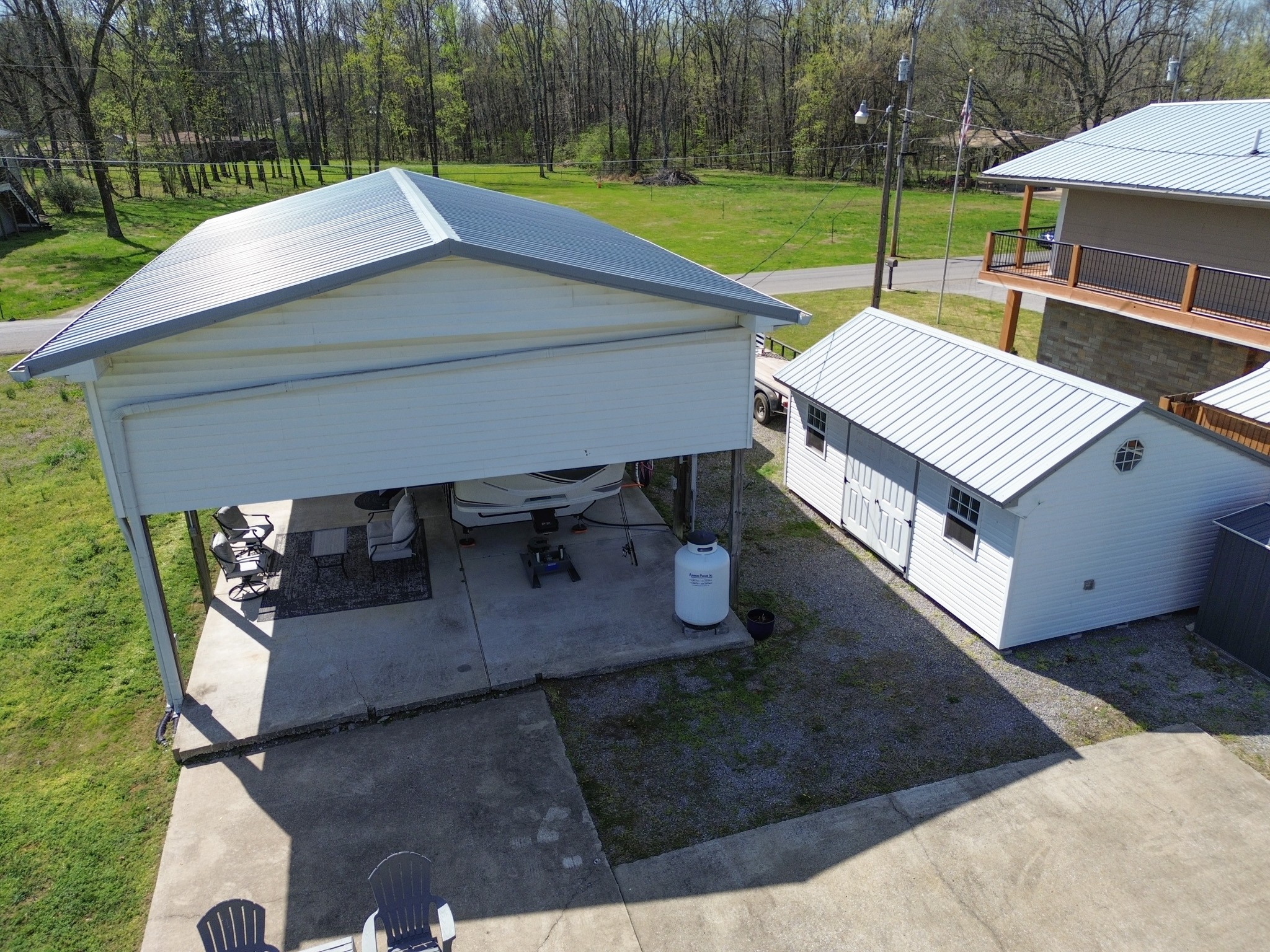 1467 Chapmansboro Road Chapmansboro, TN 37035 - Photo 10 of 13 an aerial view of a house with garden space and patio