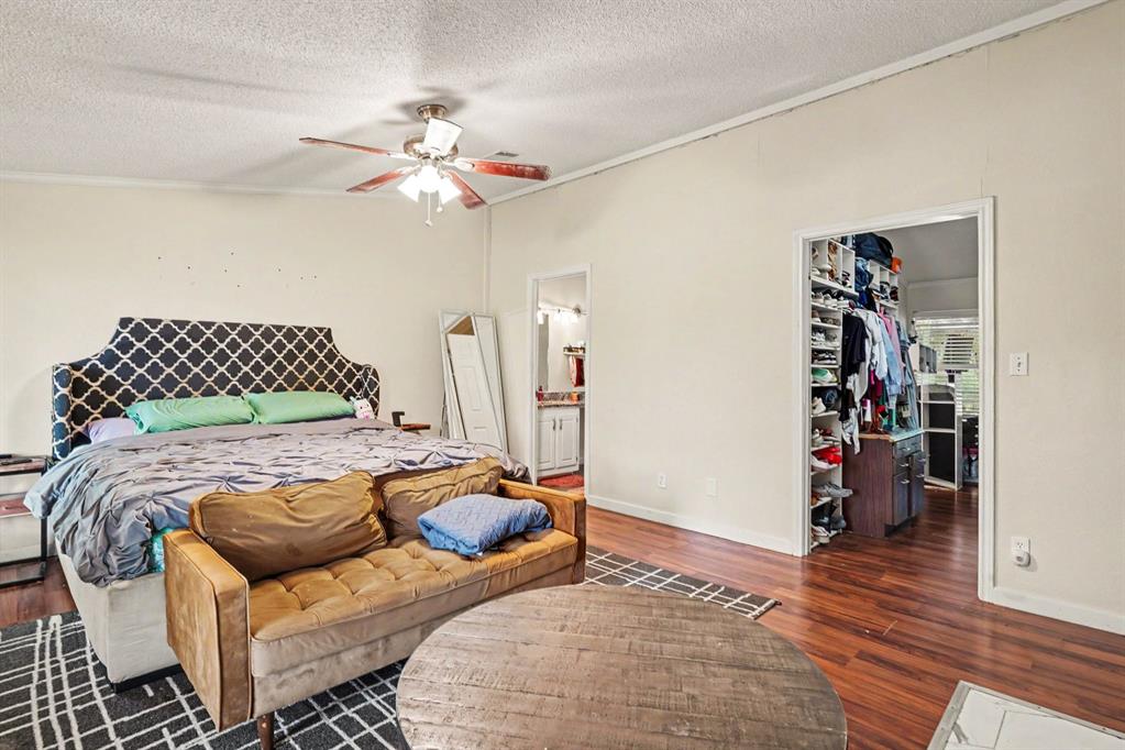 6356 Rendon Bloodworth Road Fort Worth, TX 76140 - Photo 22 of 25 Spacious room featuring wood-finish flooring and a ceiling fan with integrated lighting