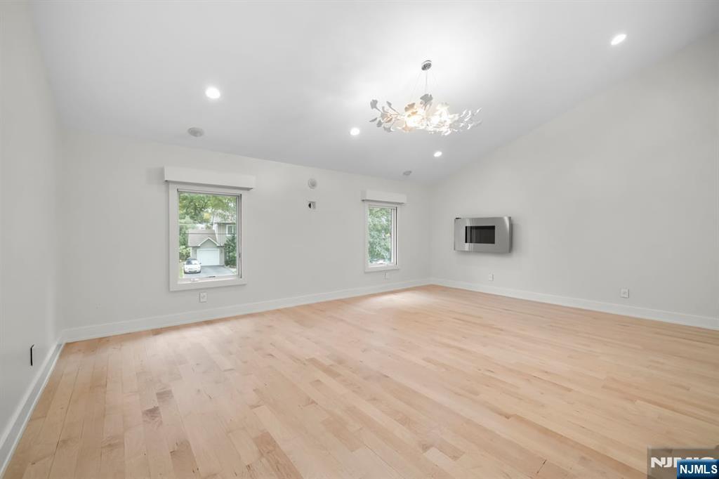 827 Alden Road Paramus, NJ 07652 - Photo 16 of 43 wooden floor in an empty room with a window
