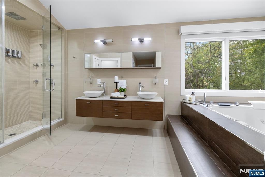 827 Alden Road Paramus, NJ 07652 - Photo 17 of 43 a room with a large window and furniture