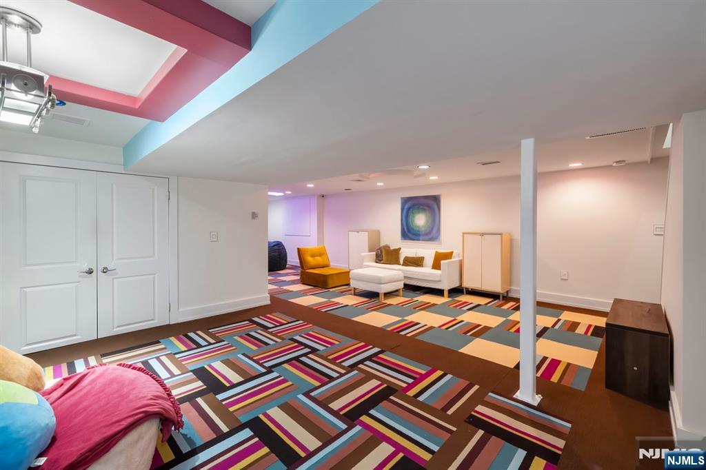 827 Alden Road Paramus, NJ 07652 - Photo 34 of 43 a bed room with a bed furniture and a mirror