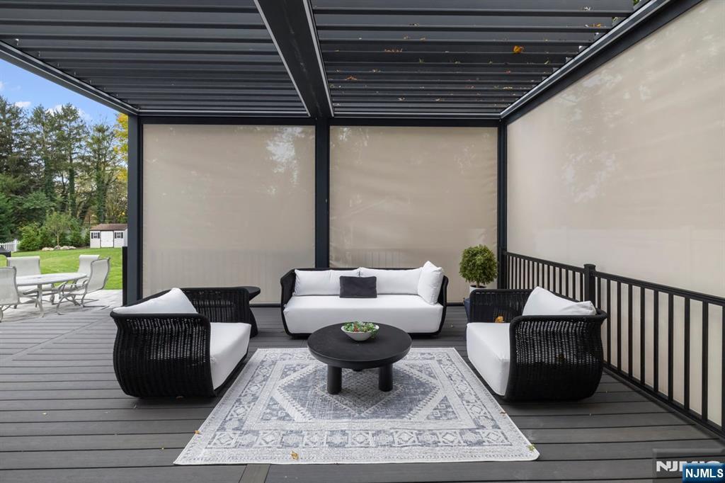 827 Alden Road Paramus, NJ 07652 - Photo 36 of 43 a living room with furniture and a large window