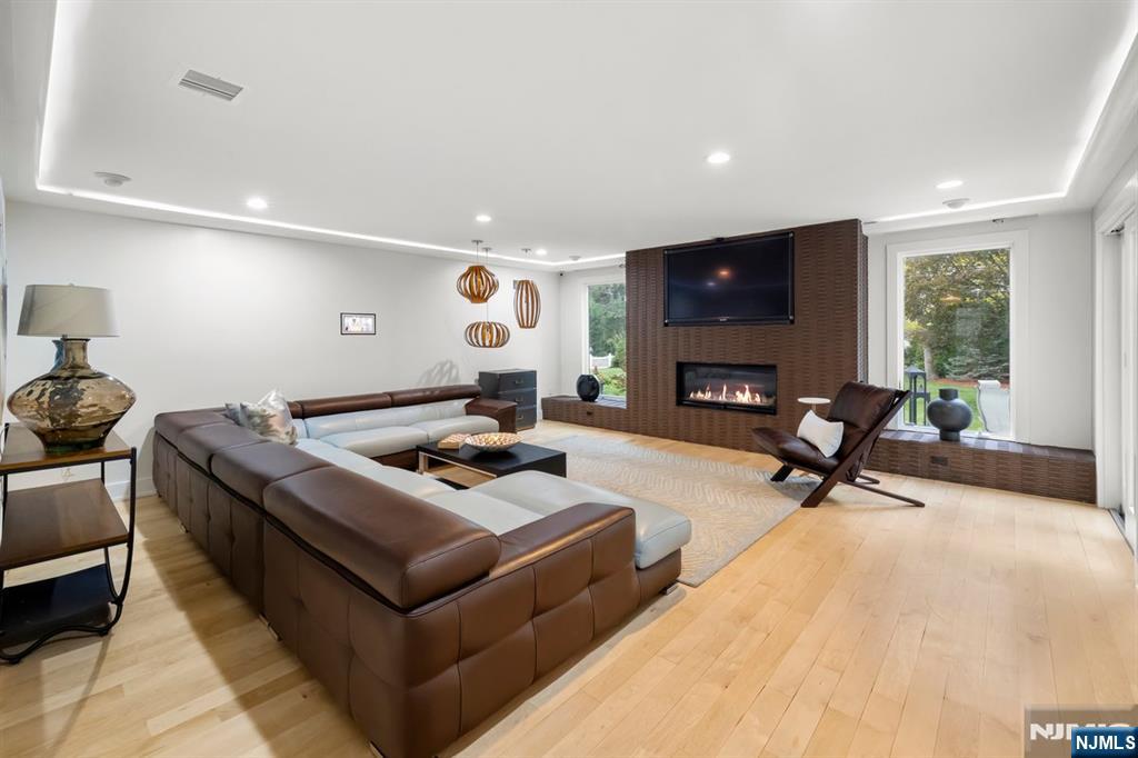 827 Alden Road Paramus, NJ 07652 - Photo 4 of 43 a living room with furniture and a flat screen tv