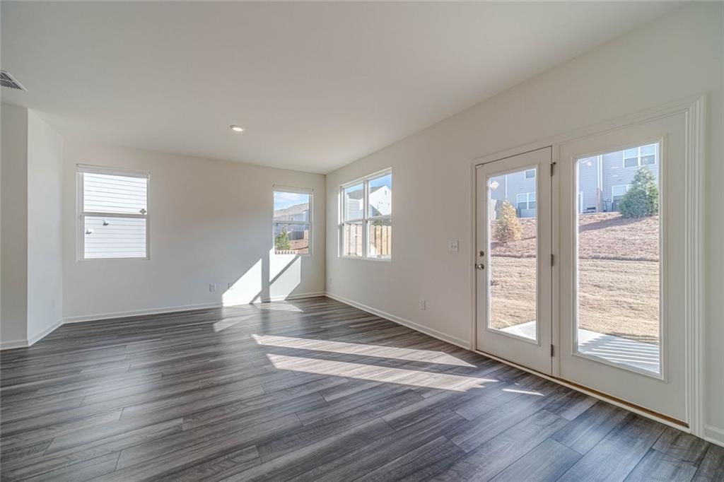 29 Padley Drive Winder, GA 30680 - Photo 6 of 25 a view of empty room with wooden floor and fan