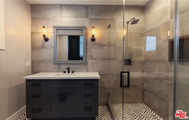 a bathroom with a sink and a mirror