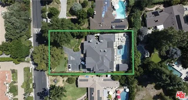 an aerial view of a house with outdoor space