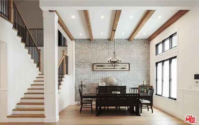 a dining room with furniture and entryway