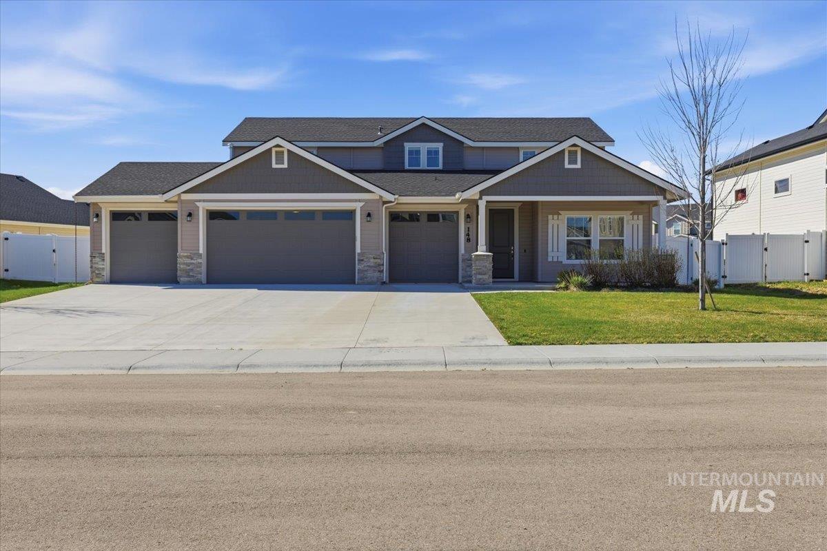 148 Homesteaders Street Middleton, ID 83644 - Photo 1 of 45 Craftsman-style house with a gate, a garage, covered porch, and concrete driveway