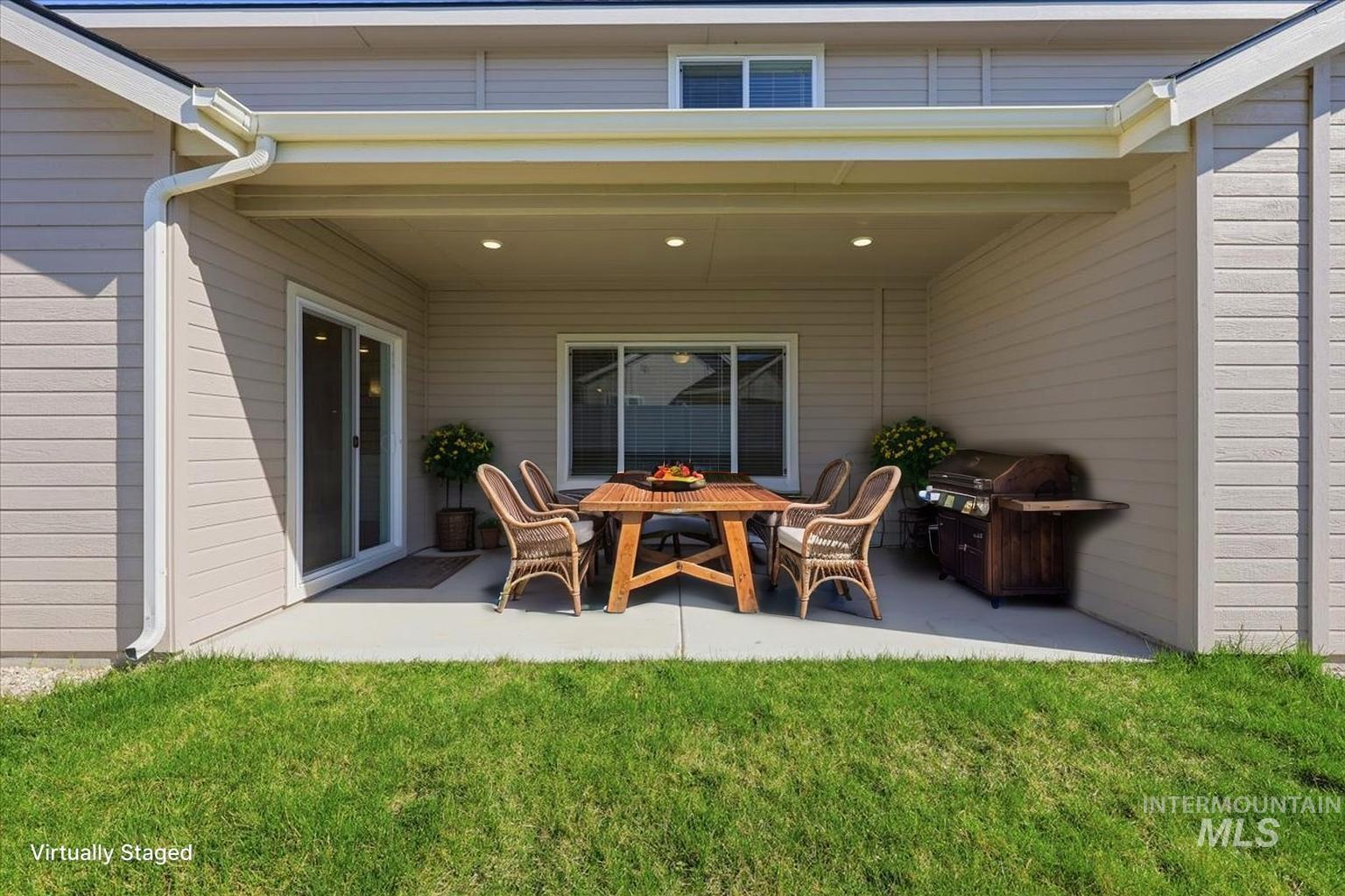 148 Homesteaders Street Middleton, ID 83644 - Photo 35 of 45 View of patio featuring a grill and outdoor dining area