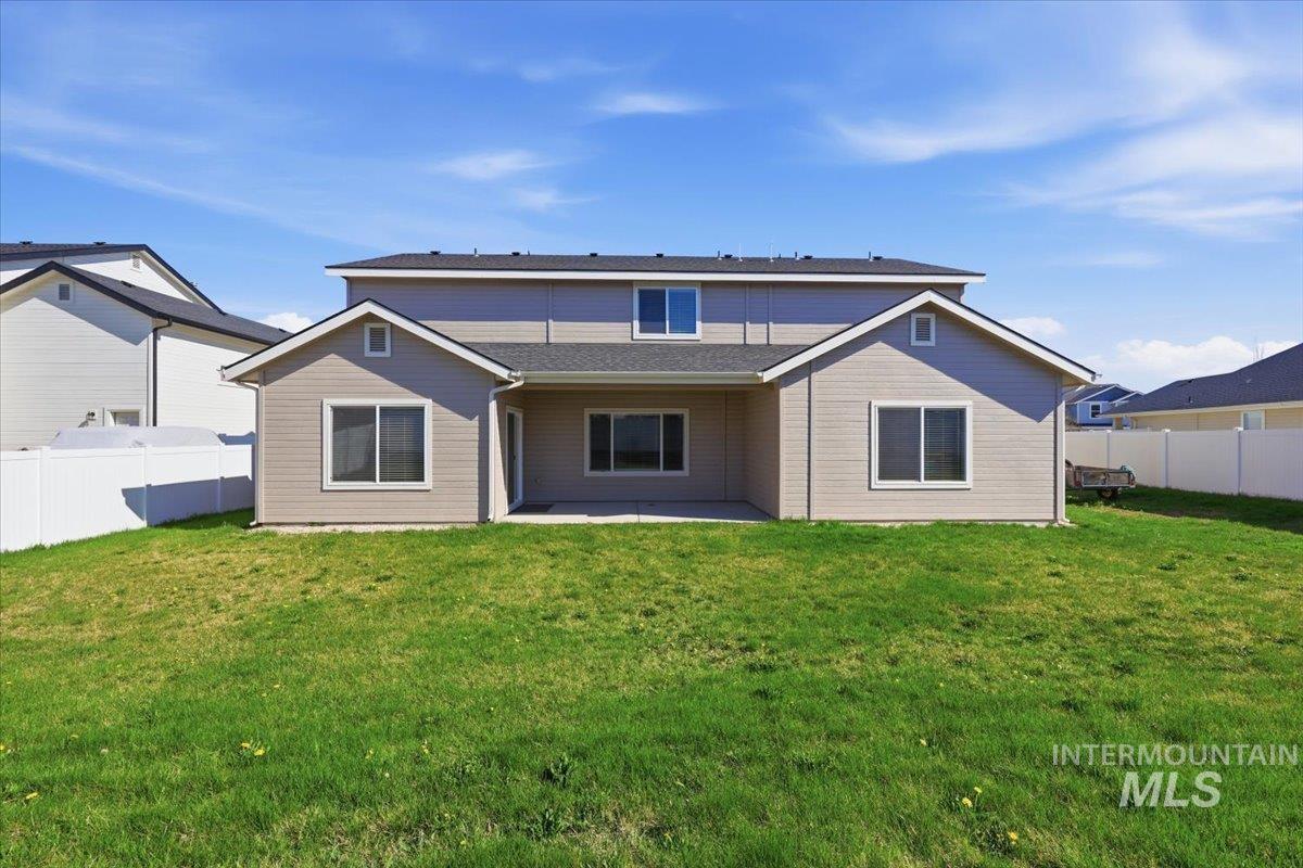 148 Homesteaders Street Middleton, ID 83644 - Photo 37 of 45 Rear view of property with a fenced backyard and a patio