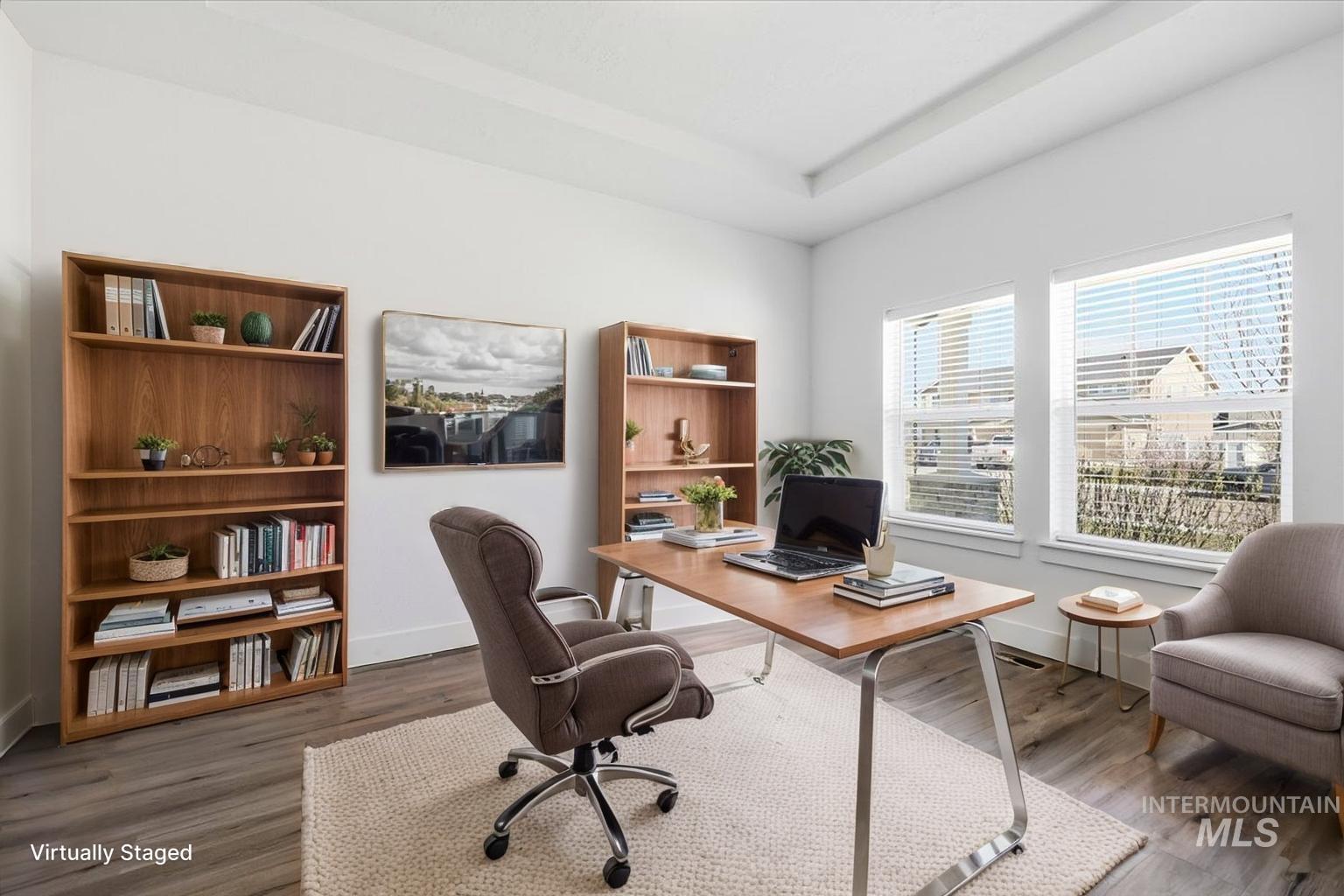 148 Homesteaders Street Middleton, ID 83644 - Photo 4 of 45 Office featuring dark wood-style flooring and a tray ceiling