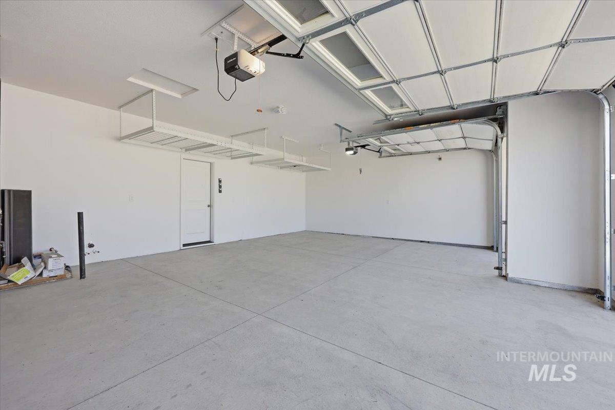 148 Homesteaders Street Middleton, ID 83644 - Photo 40 of 45 Garage featuring a garage door opener