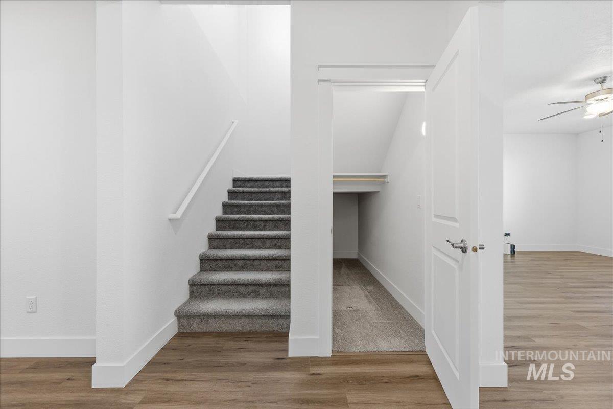 148 Homesteaders Street Middleton, ID 83644 - Photo 8 of 45 Stairway featuring wood finished floors and ceiling fan