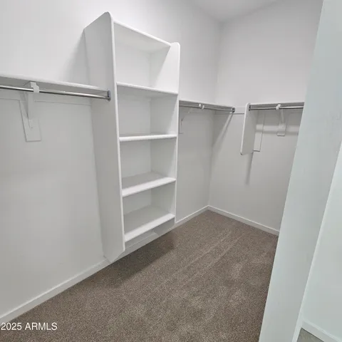 a view of an empty walk in closet