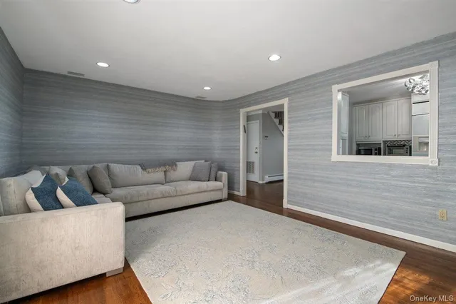 a living room with furniture and a rug