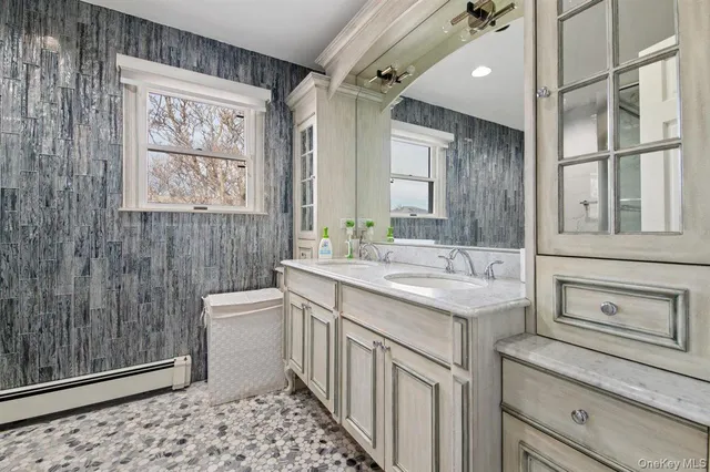 a bathroom with a sink a toilet and vanity