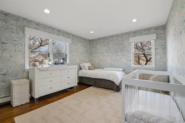 a spacious bedroom with a bed and a couch