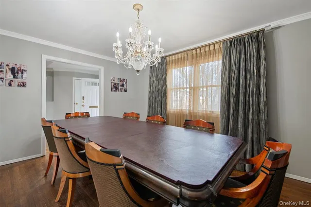 a view of a dining room with furniture and window