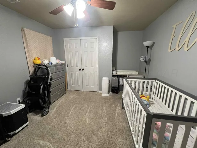 a view of a hallway with a livingroom