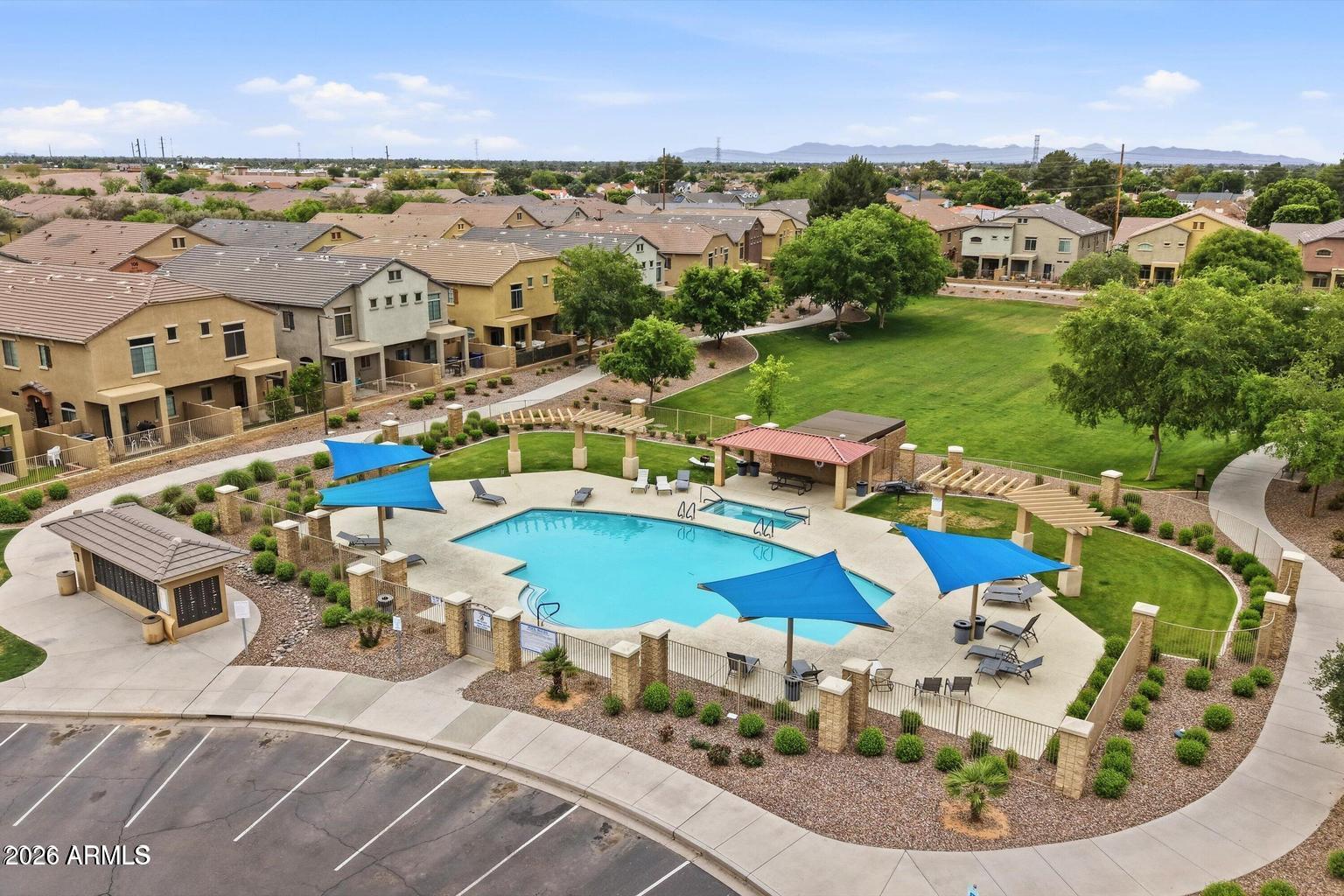 1350 South Greenfield Road, Unit 1053 Mesa, AZ 85206 - Photo 24 of 25 an aerial view of a house with a swimming pool yard and outdoor seating