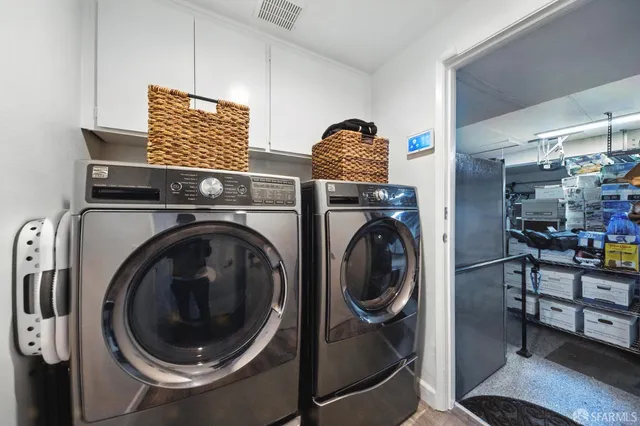 a view of a storage & utility room with washer and dryer