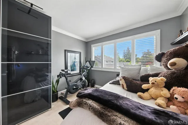 a bed room with a bed and a window