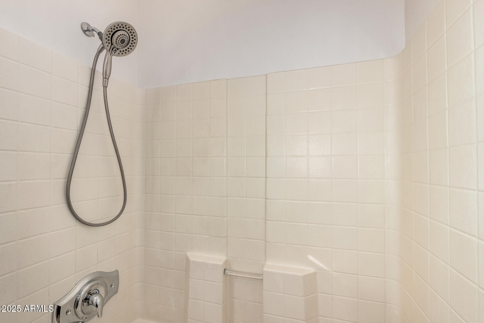 14784 West Riviera Drive Surprise, AZ 85379 - Photo 16 of 28 a bathroom with a shower and a window
