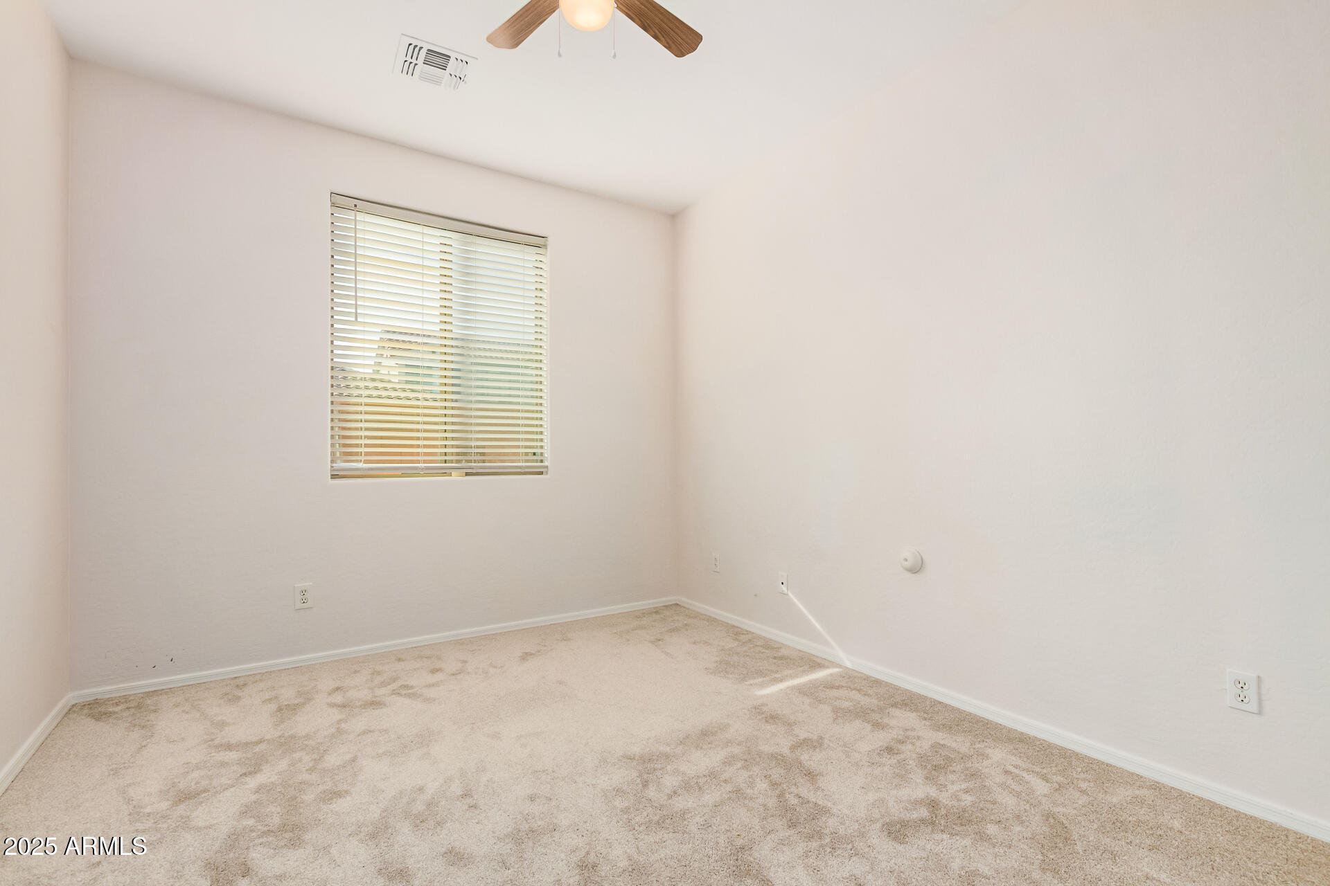 14784 West Riviera Drive Surprise, AZ 85379 - Photo 17 of 28 an empty room with a window