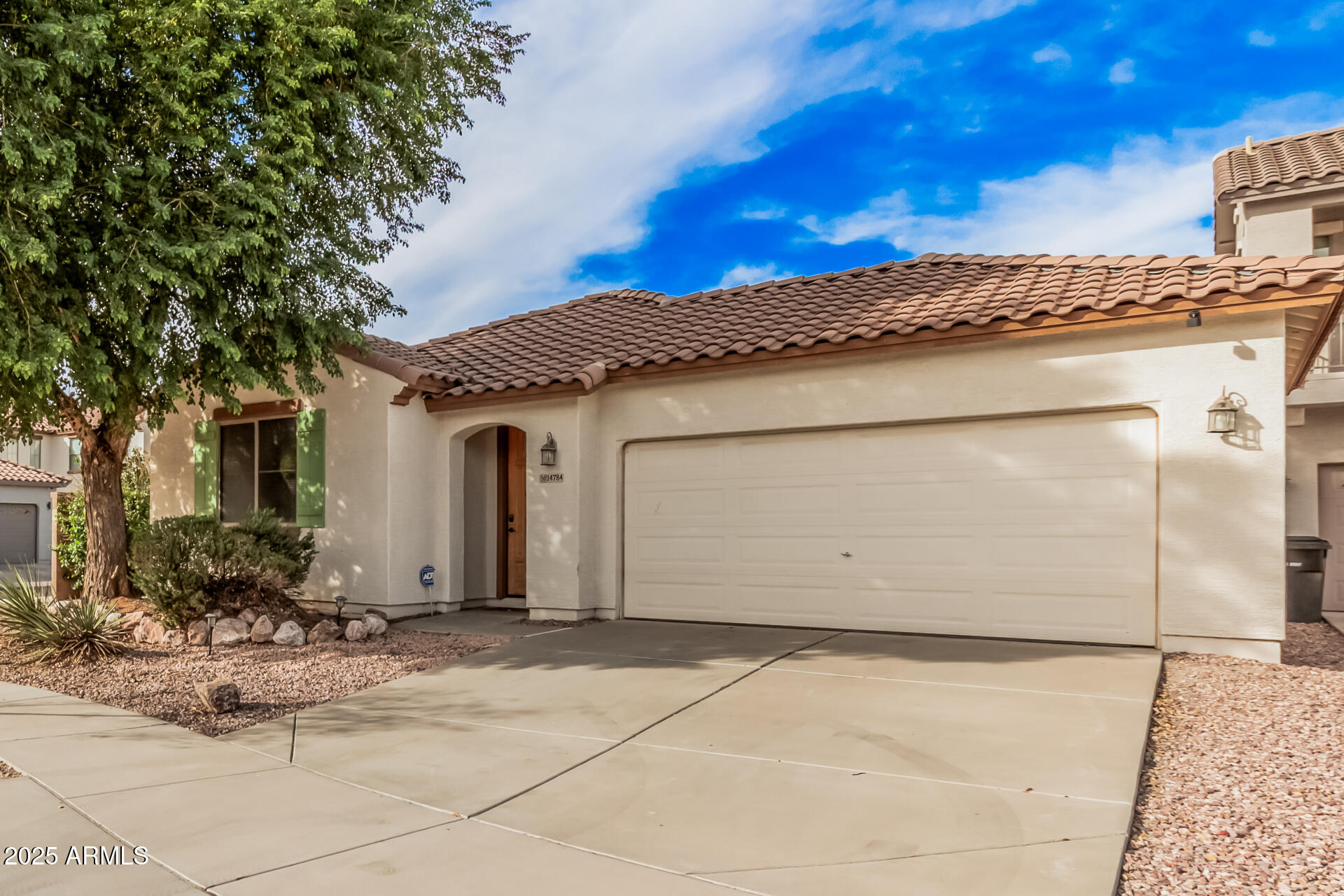 14784 West Riviera Drive Surprise, AZ 85379 - Photo 2 of 28 a front view of a house with garden