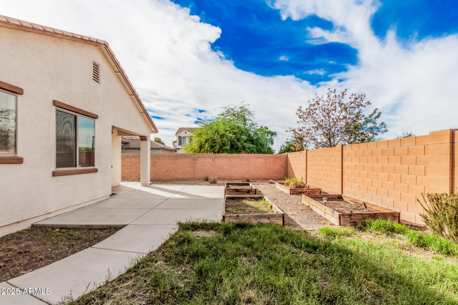 14784 West Riviera Drive Surprise, AZ 85379 - Photo 27 of 28 a view of a backyard with plants