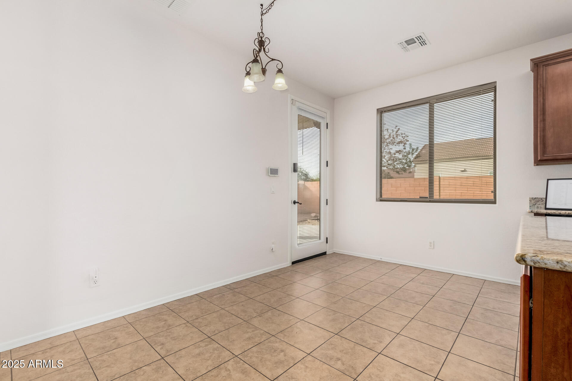14784 West Riviera Drive Surprise, AZ 85379 - Photo 8 of 28 an empty room with windows