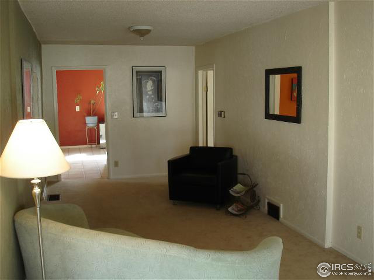 604 East Baseline Road Lafayette, CO 80026 - Photo 3 of 11 a living room with furniture and a lamp