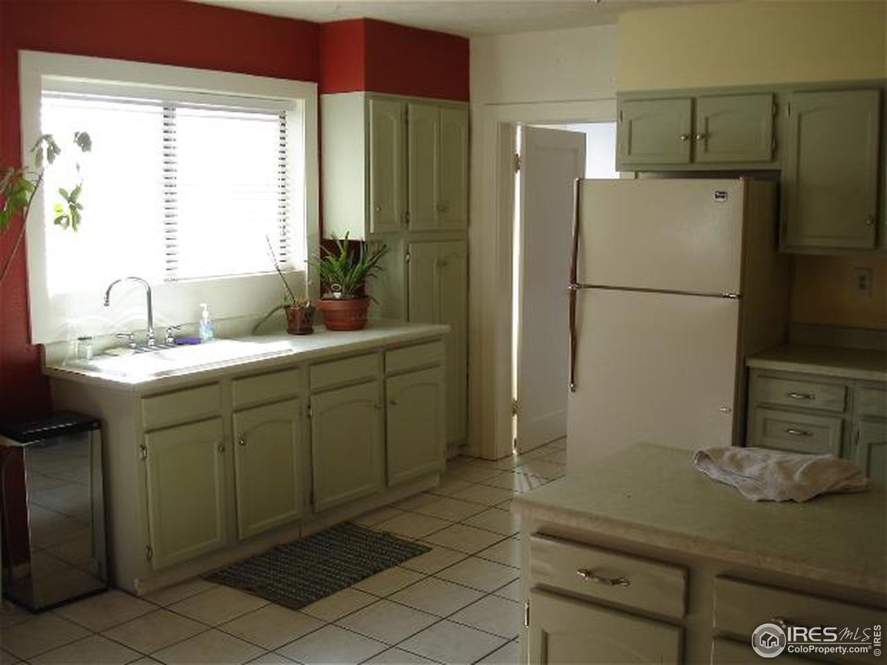 604 East Baseline Road Lafayette, CO 80026 - Photo 4 of 11 a bathroom with a sink and a mirror