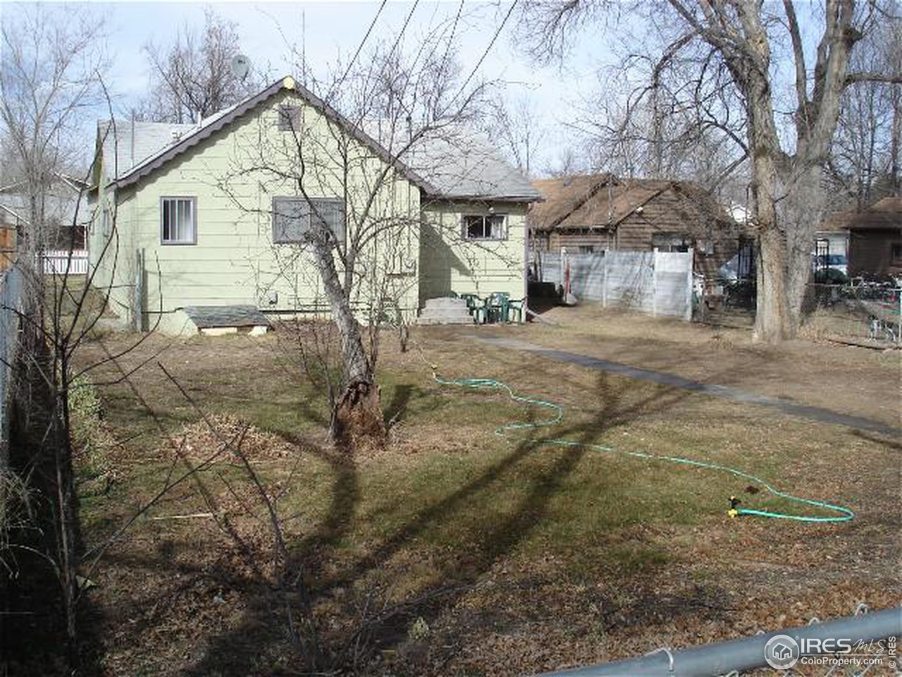 604 East Baseline Road Lafayette, CO 80026 - Photo 10 of 11 a view of a house with a yard covered in snow