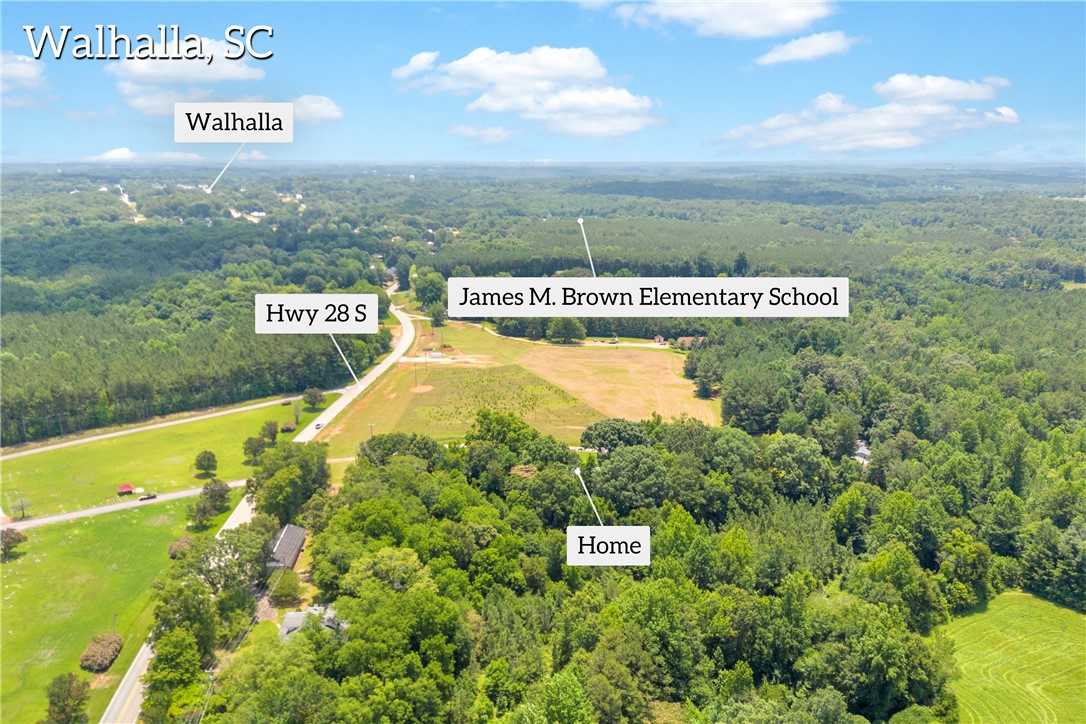 150 Newberry Road Walhalla, SC 29691 - Photo 41 of 47 An aerial perspective reveals the property nestled amidst lush woodlands, offering secluded tranquility near a main thoroughfare.