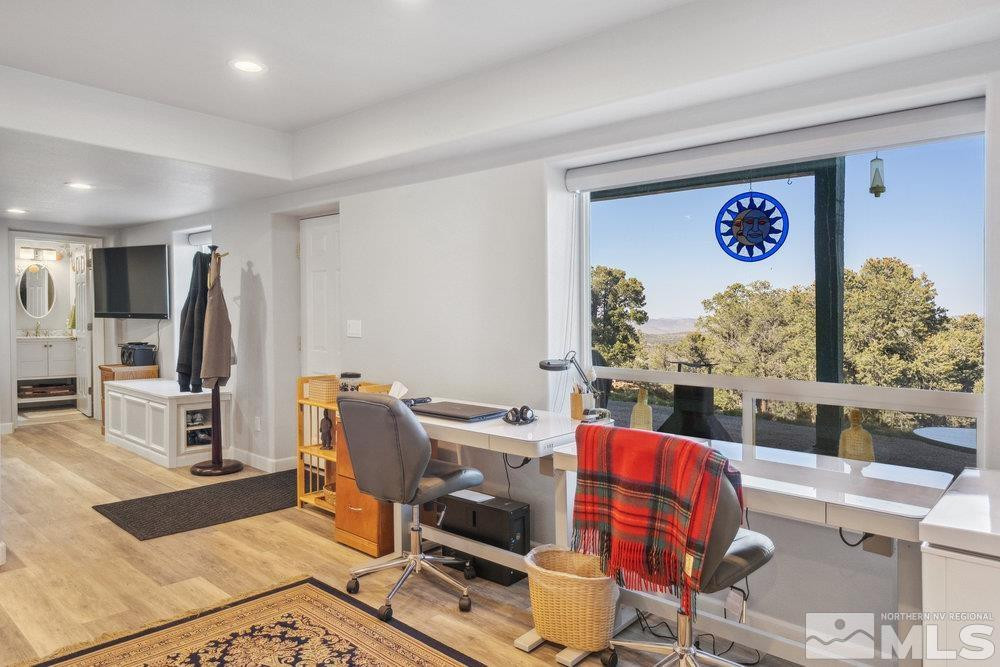 2045 Flint Road Reno, NV 89521 - Photo 23 of 33 a view of a dining room with furniture a kitchen and chandelier