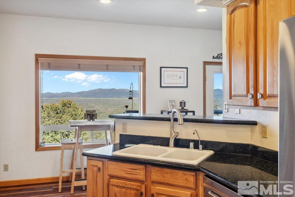 2045 Flint Road Reno, NV 89521 - Photo 8 of 33 a kitchen with a sink and a refrigerator